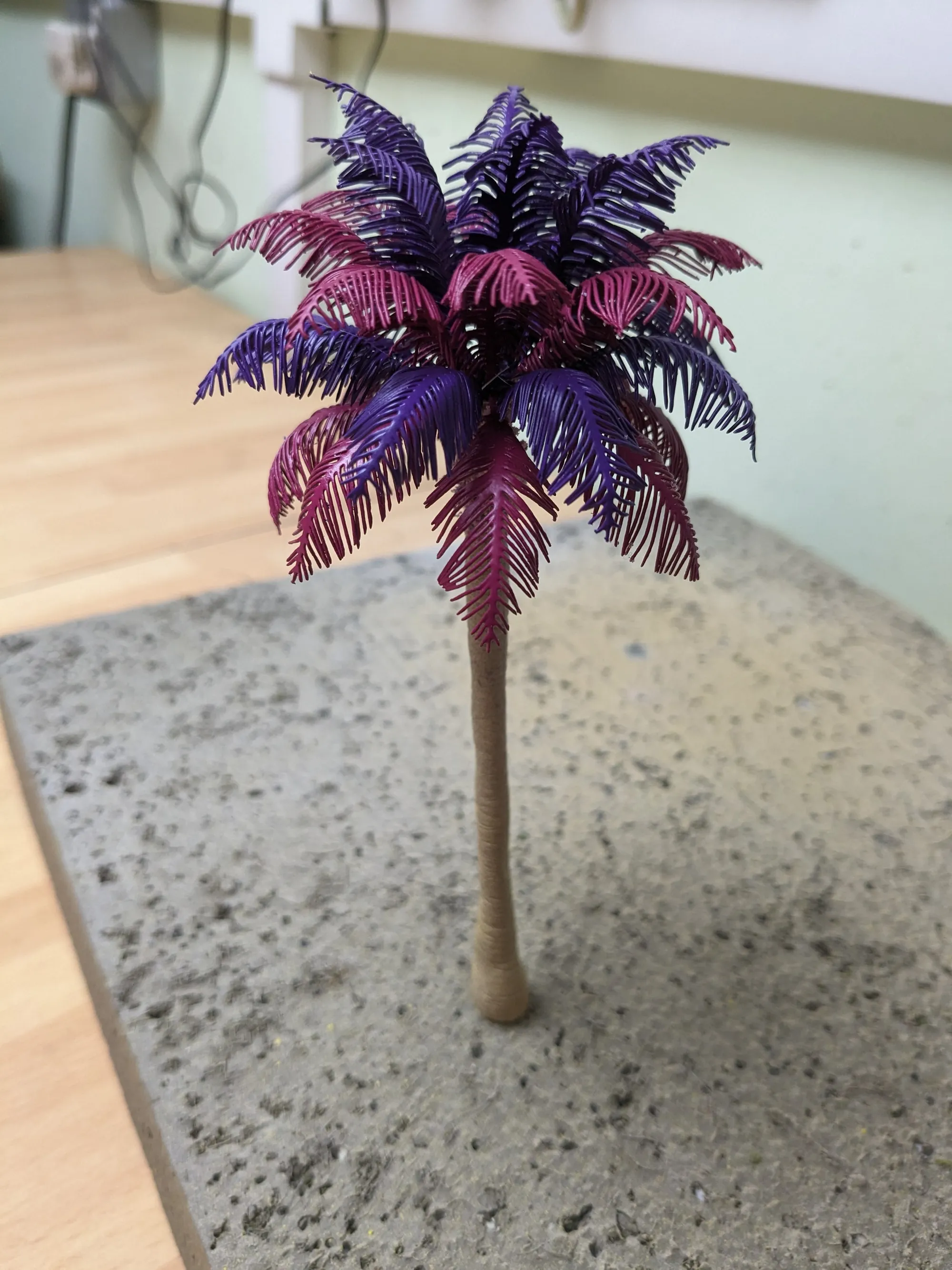 A palm tree in purple and pink